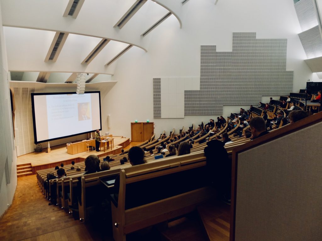 View from the rear of a large lecture theatre with stepped seating