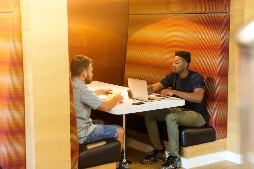 Two male students working together at a desk